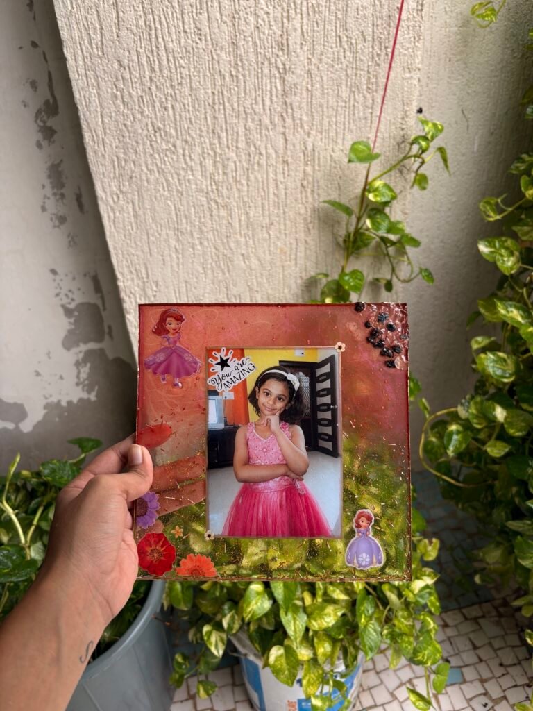 Close-up of resin art detailing on sibling photo frame